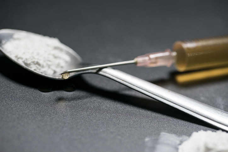 A heroin needle and spoon