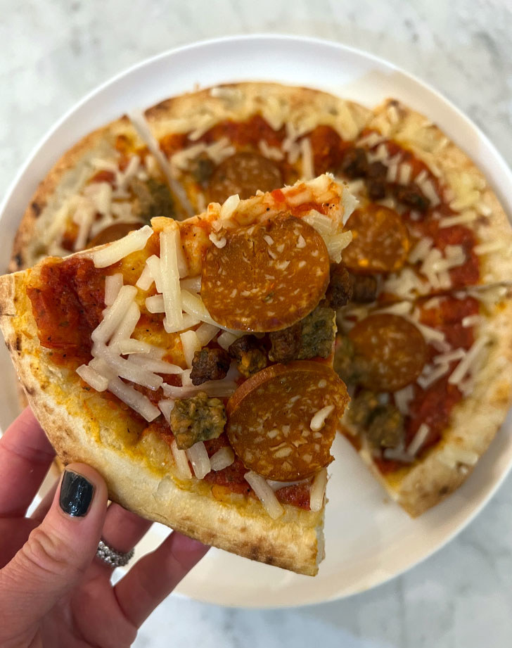 A cooked meat-lover&#x27;s vegan pizza