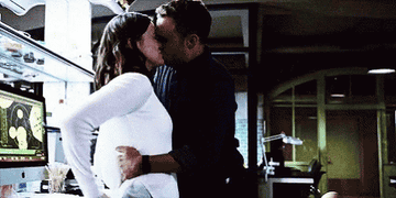 Fitz and Simmons kissing at work