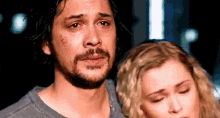 Clarke and Bellamy huddled together on &quot;The 100&quot;