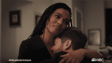 Helen holding Max and rubbing his back while smiling on &quot;New Amsterdam&quot;