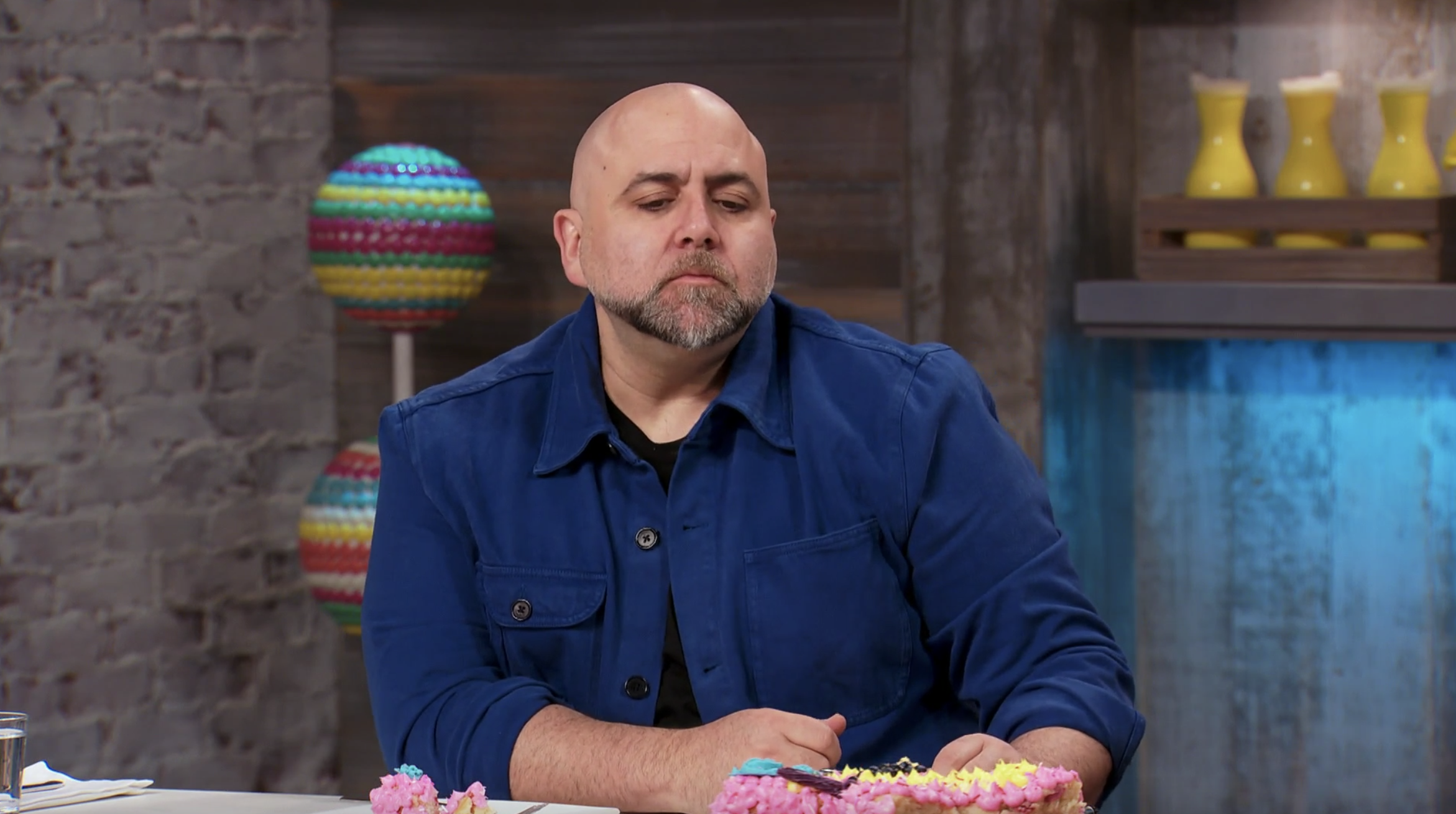 Duff Goldman furrowing his brows in confusion as he samples food on "Kids Baking Championship"