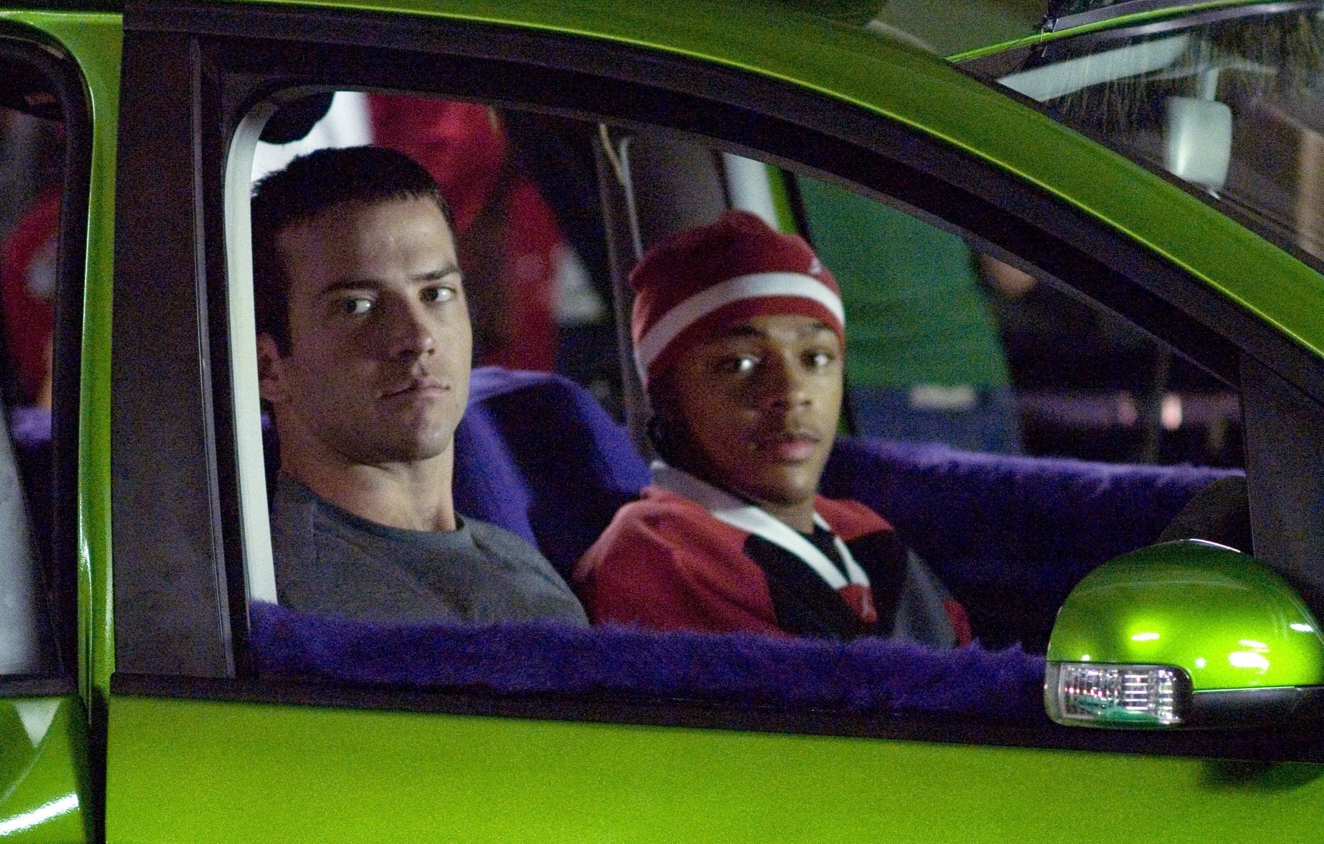 Two men look out of a car in &quot;The Fast and the Furious: Tokyo Drift&quot;