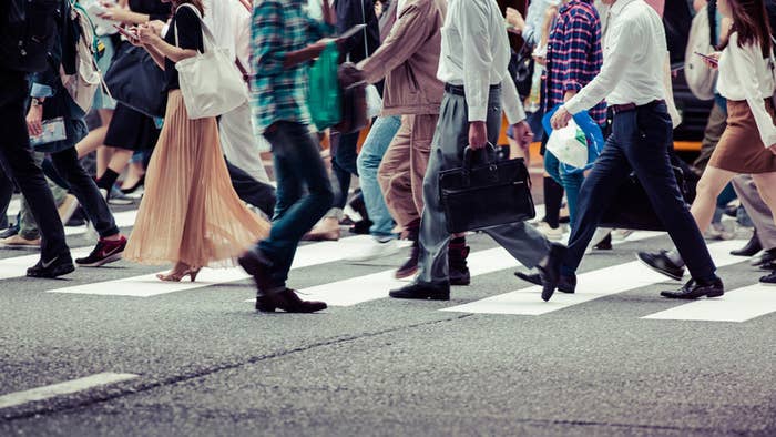 People walking across a crosswalk