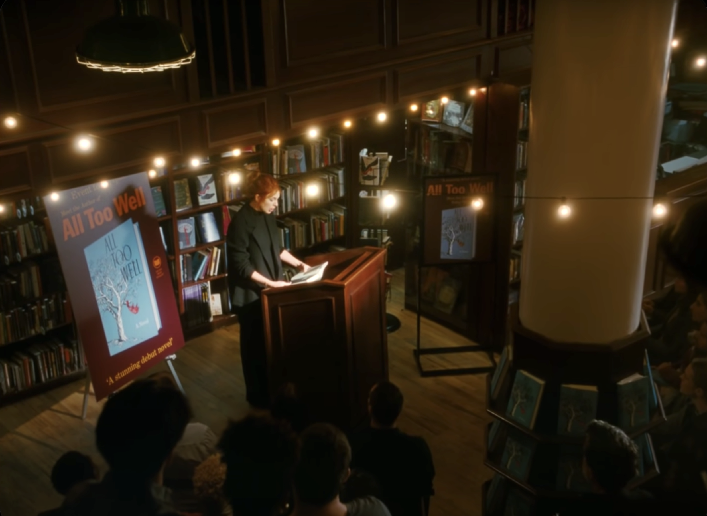 Taylor Swift reads a book in front of an audience in her music video for &quot;All Too Well&quot;