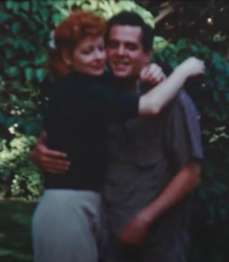 Lucy and Desi embrace in their yard