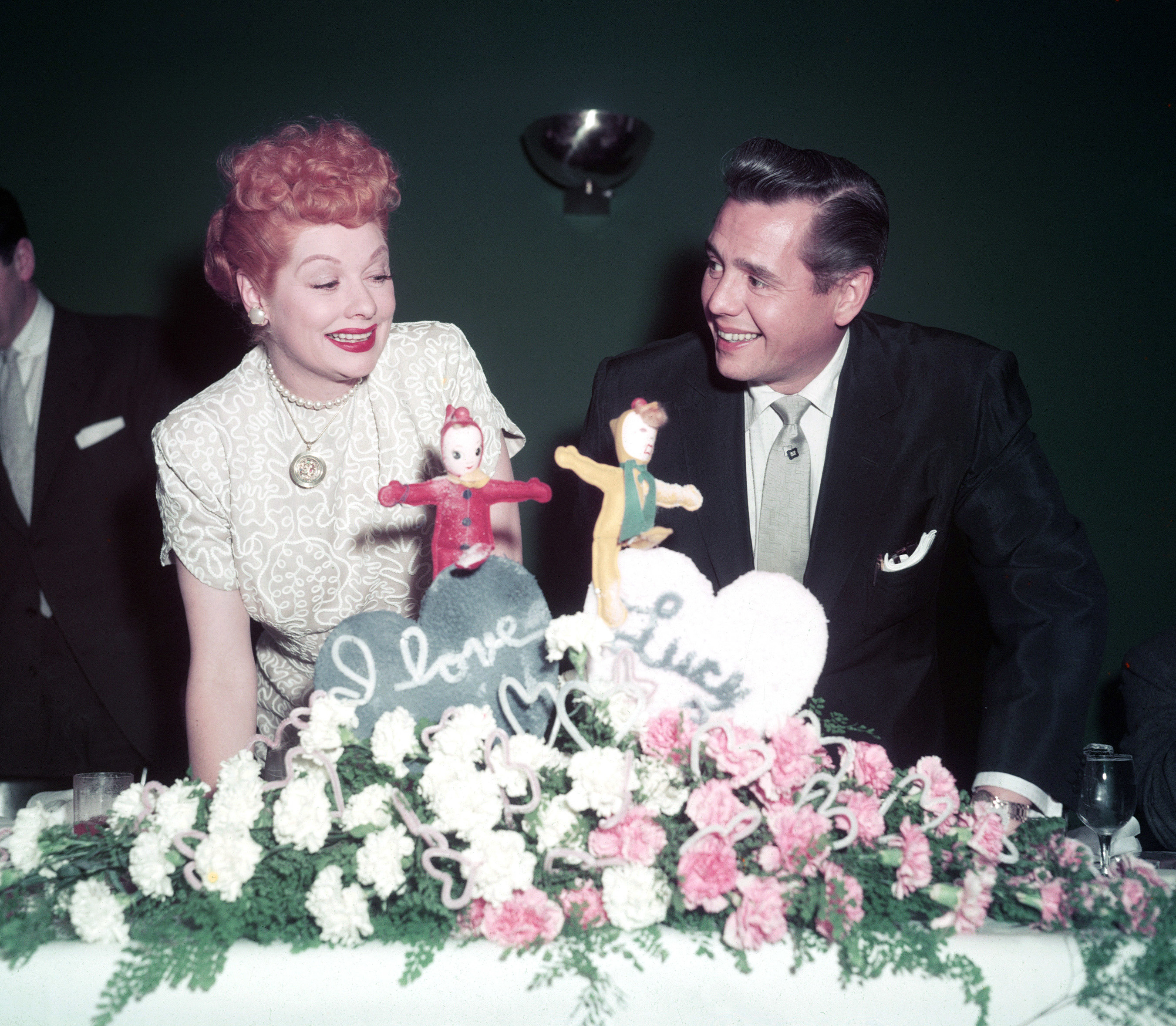 Lucille Ball and Desi Arnaz sit together while taking a break from filming &quot;I Love Lucy&quot;