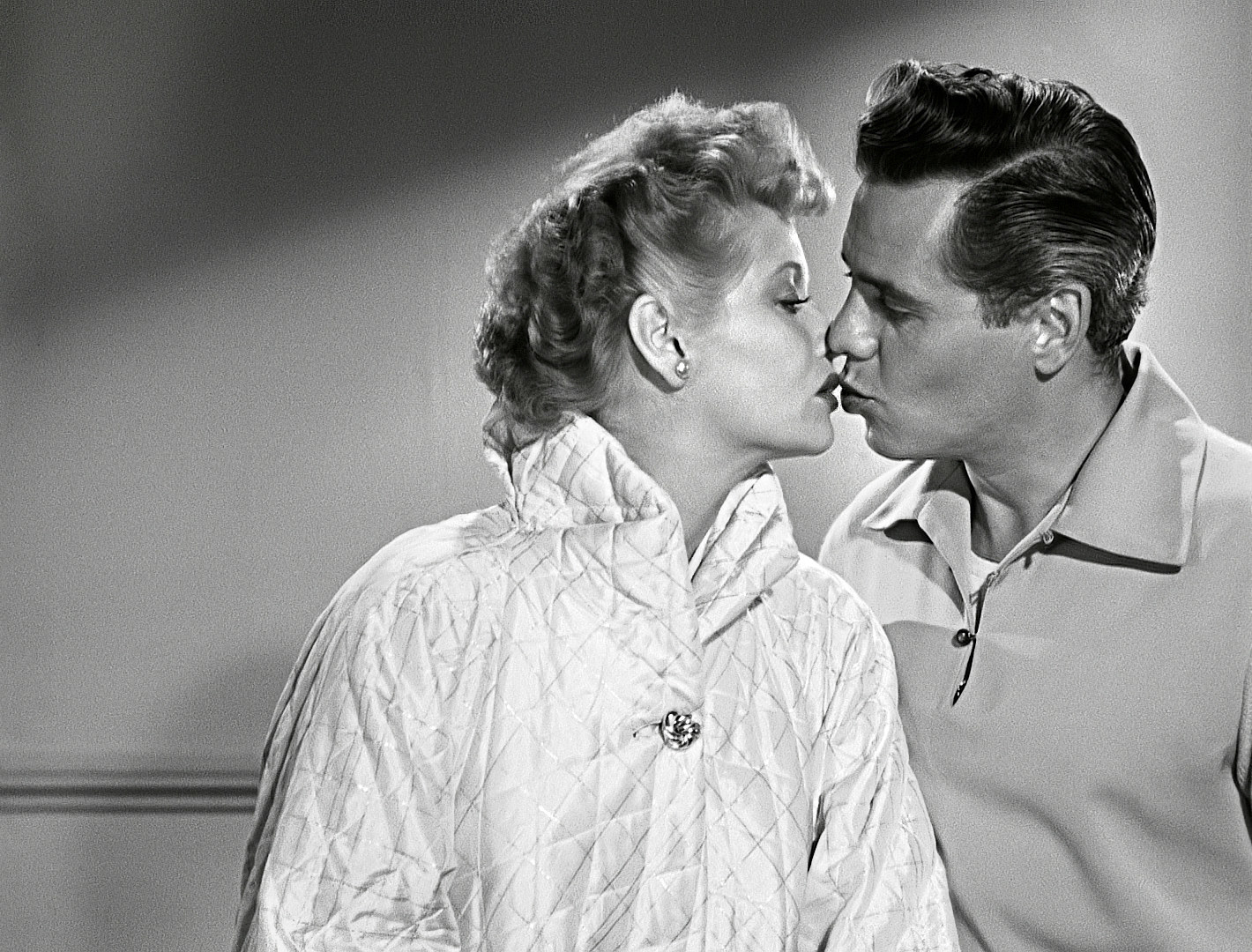 Lucy and Desi kiss in an &quot;I Love Lucy&quot; on set photo