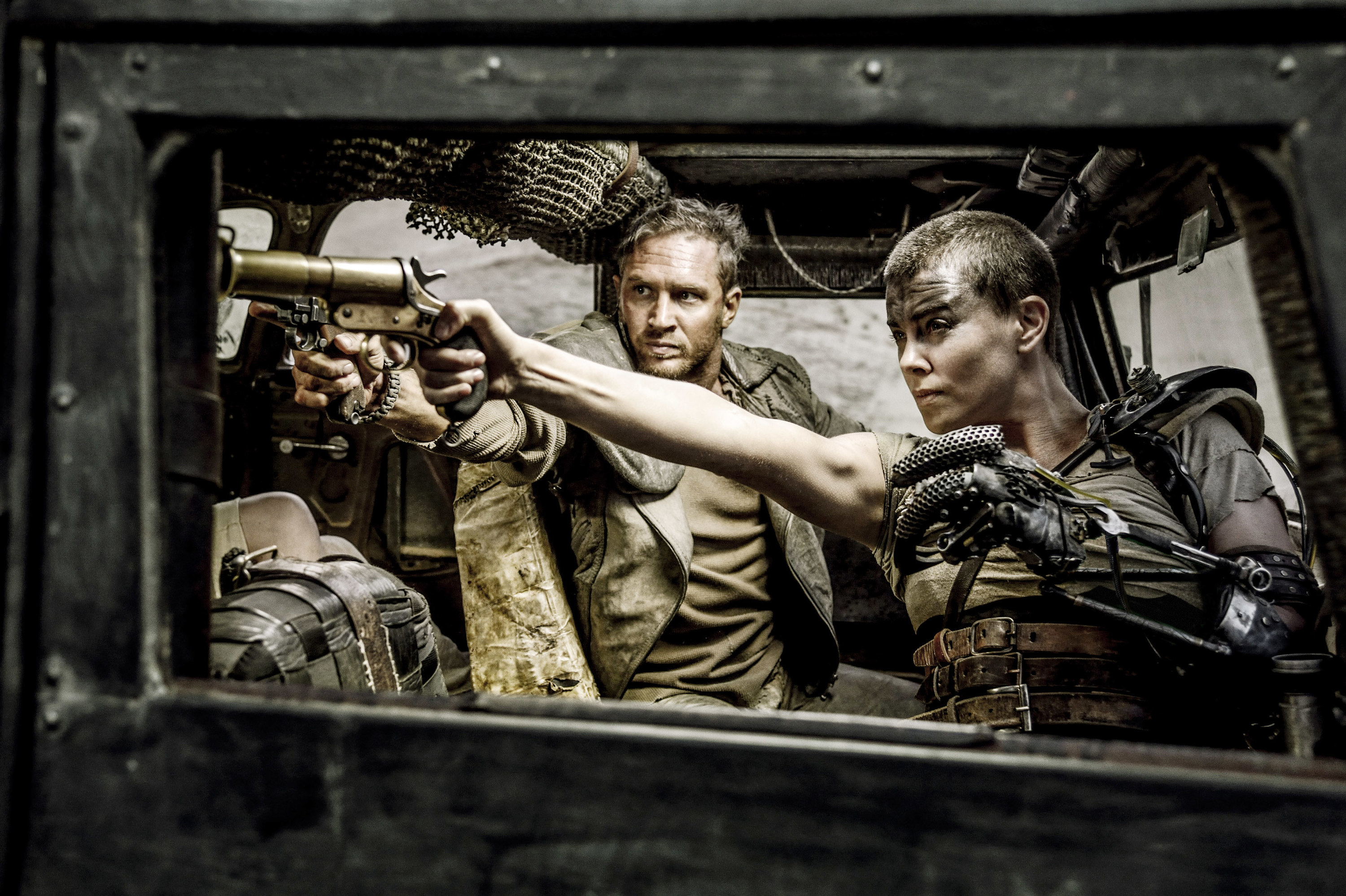 Still of Tom and Charlize as Max and Furiosa in the movie