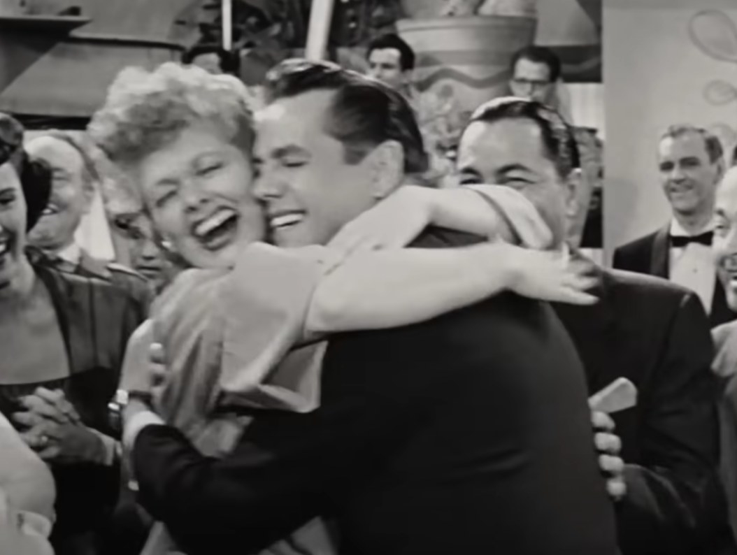 Lucy and Desi laugh and hug on the &quot;I Love Lucy&quot; set