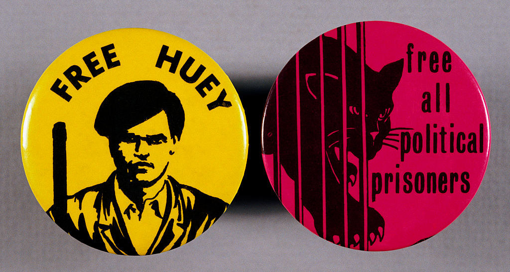 Pair of Black Panther party buttons, one reading &quot;Free All Political Prisoners&quot; and one reading &quot;Free Huey&quot;