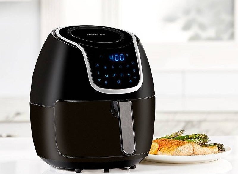 light blue and black cutting boards with muted colorful knives on top of them