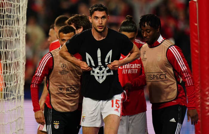 Roman Yaremchuk shows off Ukrainian trident shirt after goal