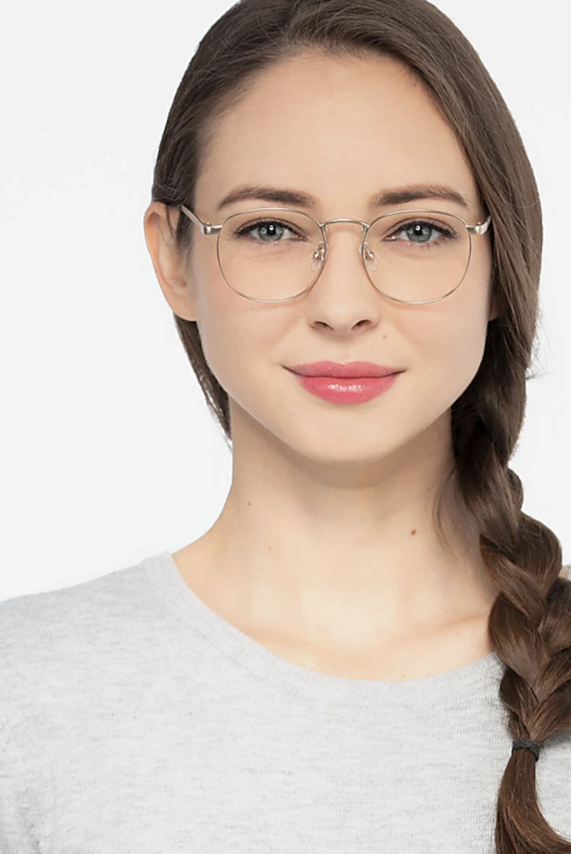 model wearing silver round frame glasses