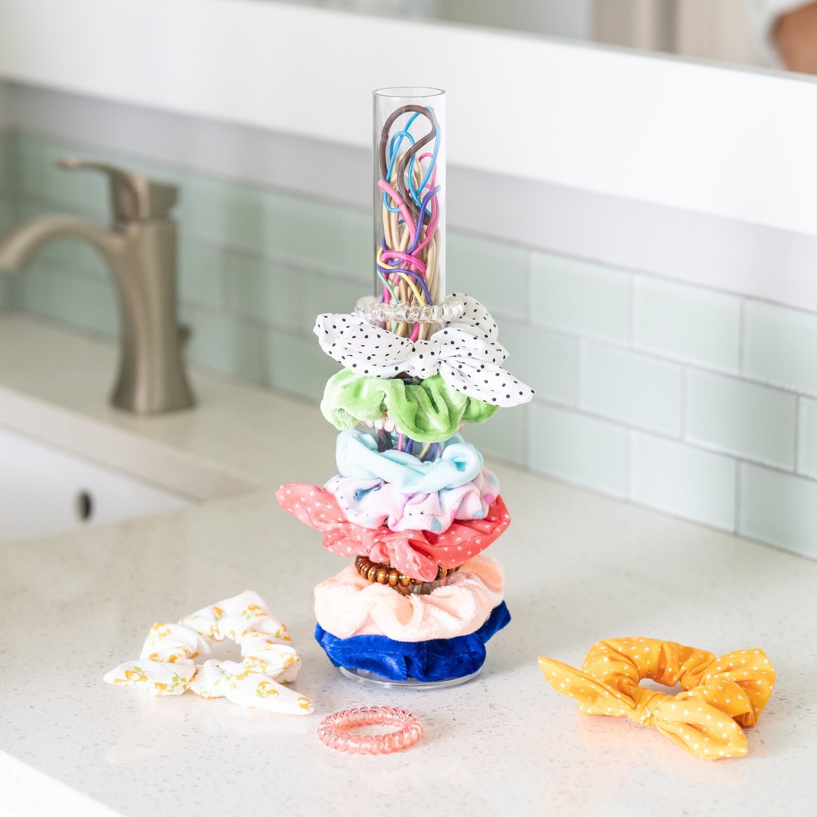 A variety of scrunchies placed on the holder