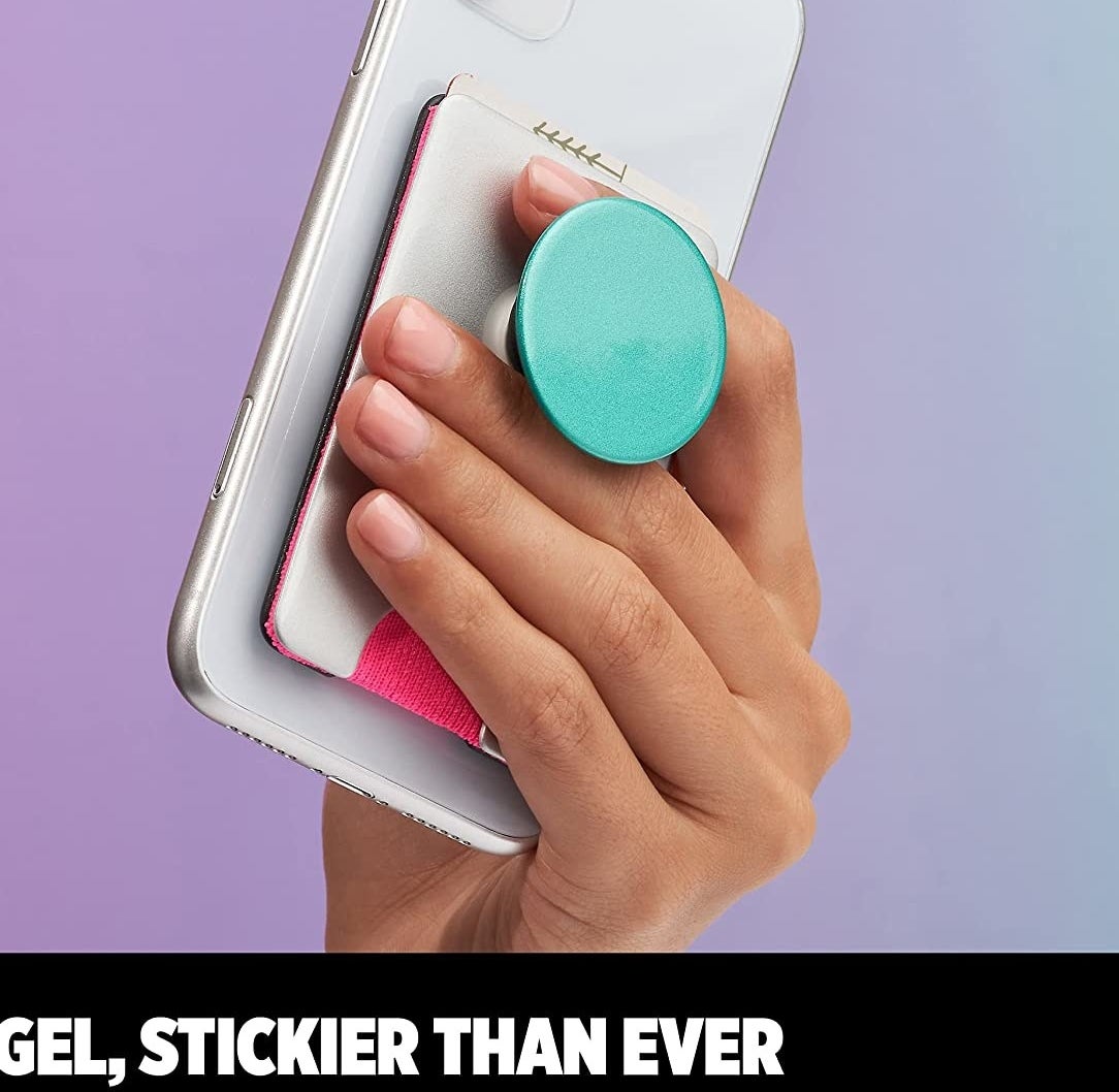 A person holding their phone by the grip