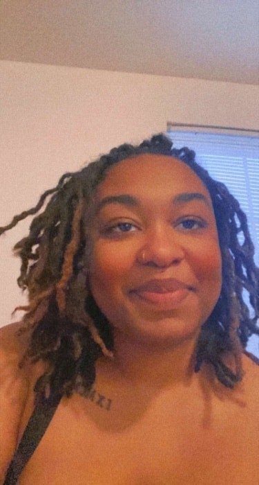 A Community User shows off their locs in a selfie