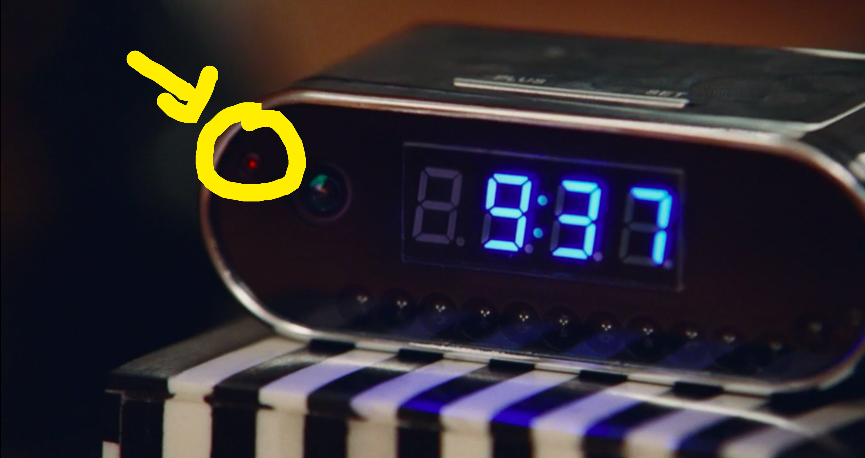 A closeup of a digital clock that&#x27;s also records video