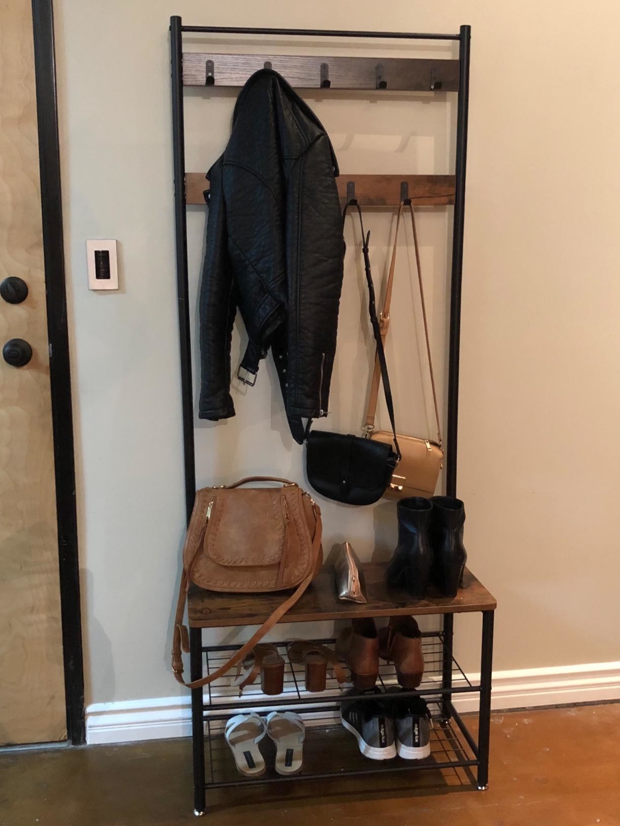 Reviewer coat and shoe rack next to door
