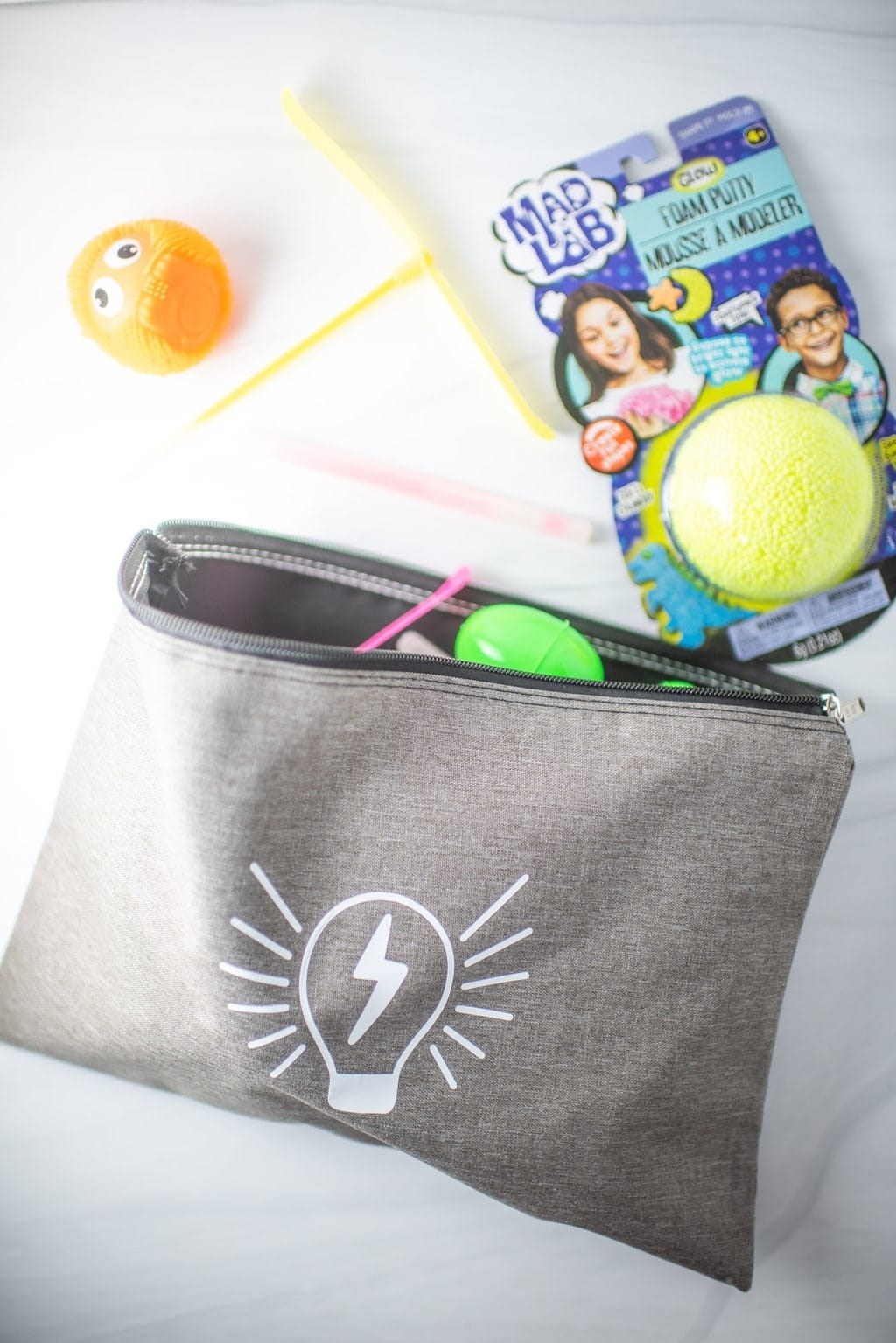 Blogger&#x27;s photo of a gray busy bag with foam putty and other items