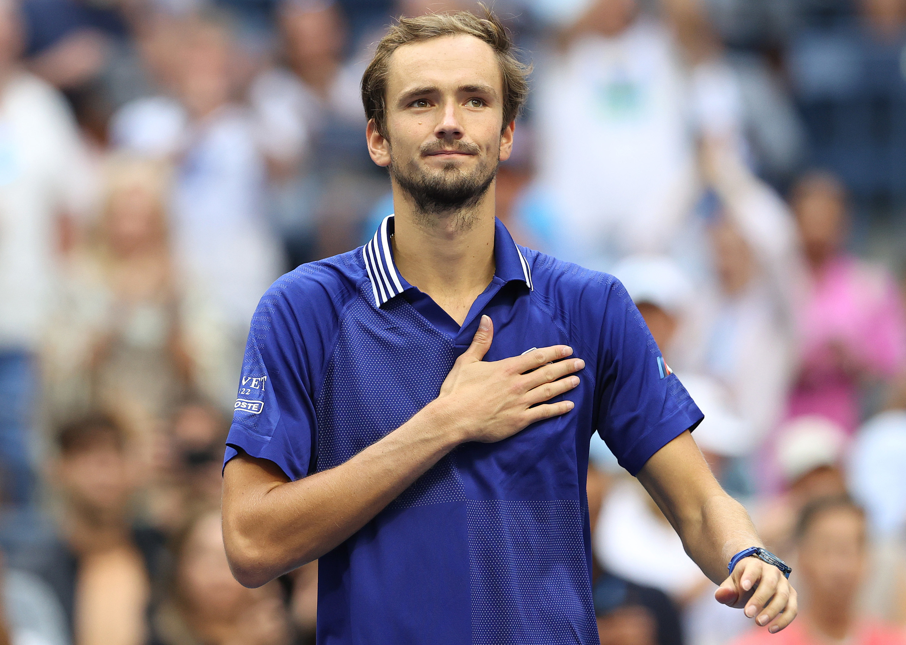 Daniil Medvedev holds a hand over his heart, appreciative of the crowd