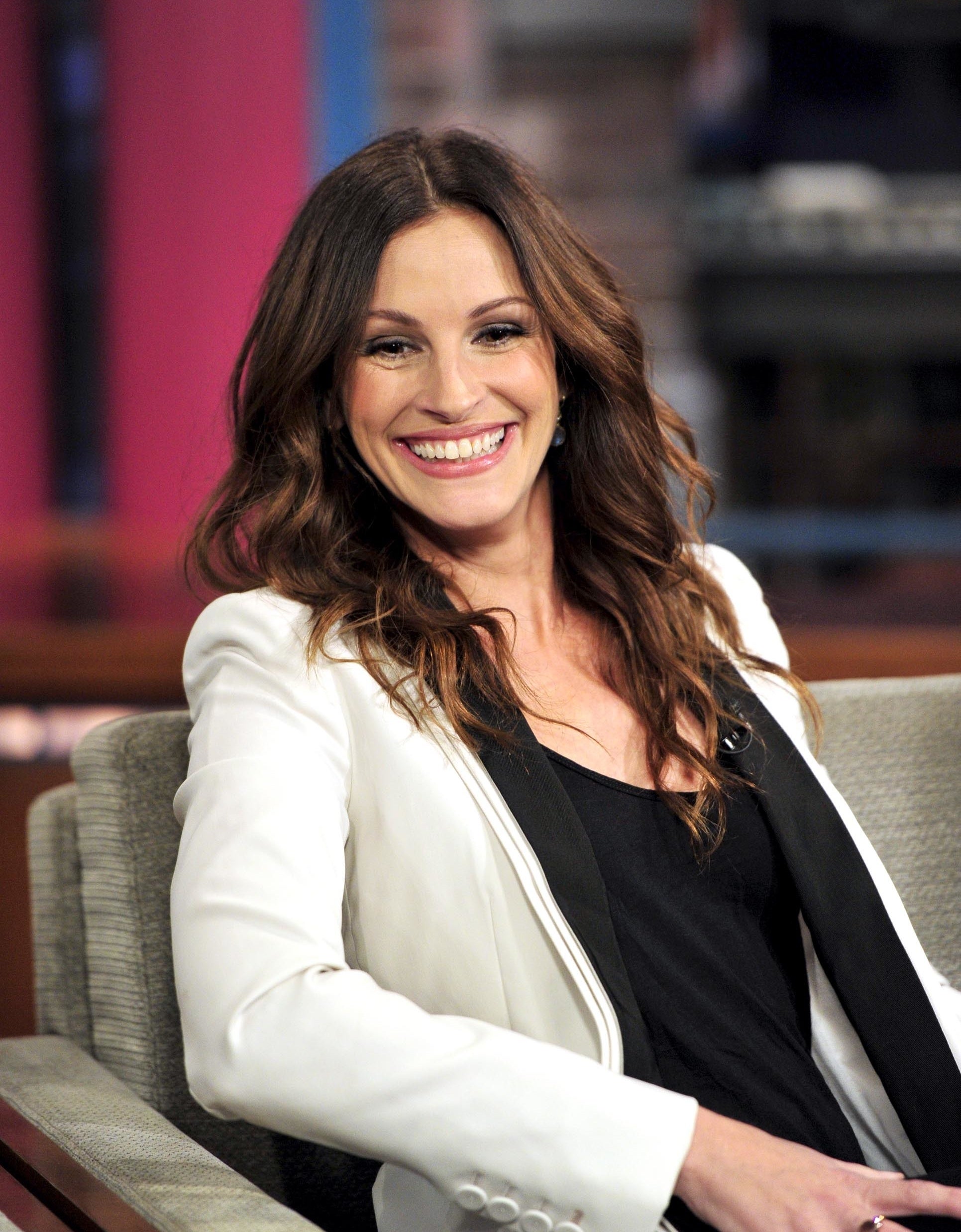 Julia Roberts smiling during a talk show appearance in 2010