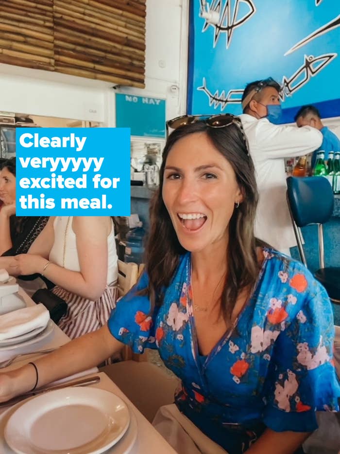 A woman sitting at a restaurant table.