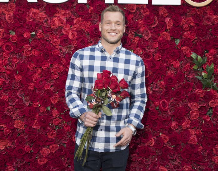 Colton holds a bouquet of roses