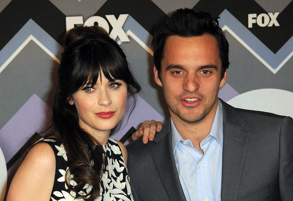Zooey and Jake pose together for a photo at a red carpet event