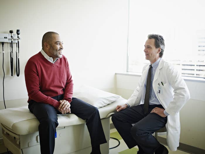 A doctor speaking with a Black patient