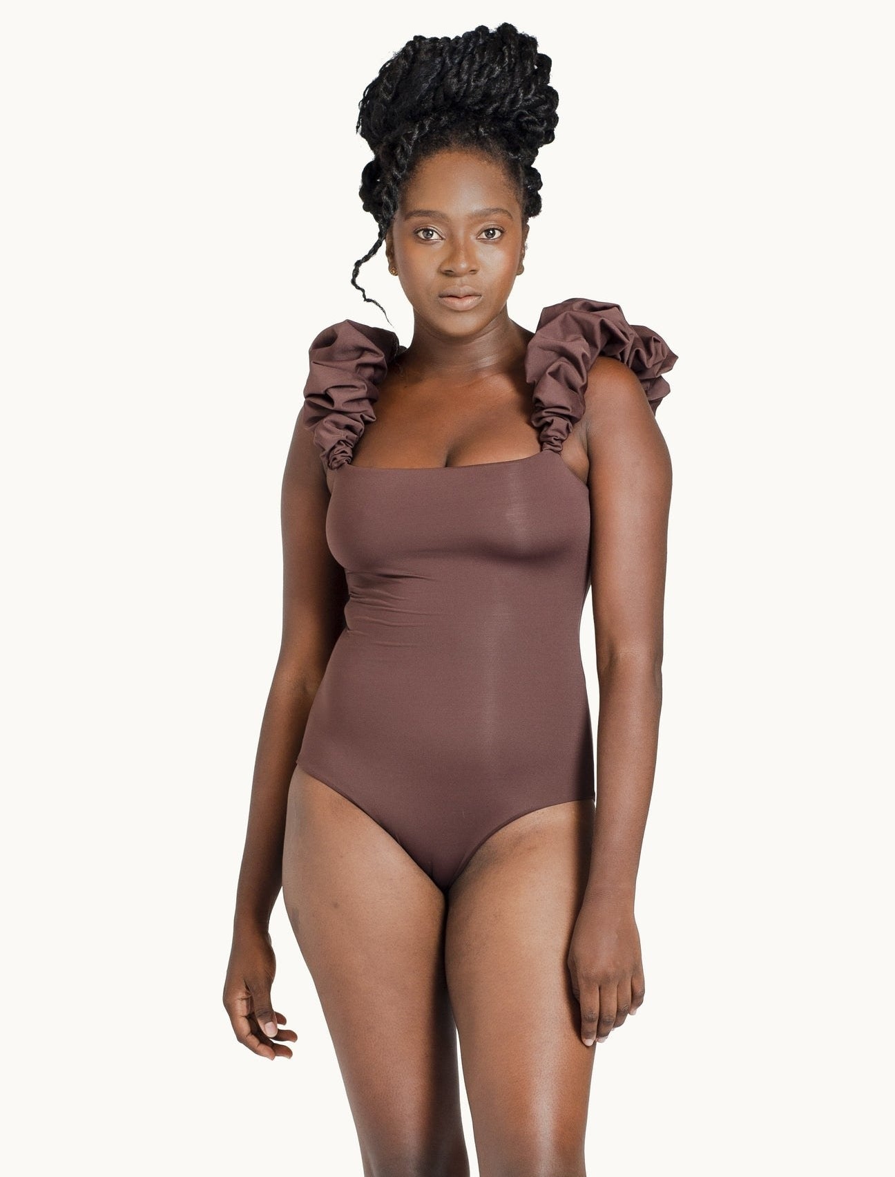 Model wearing brown one piece