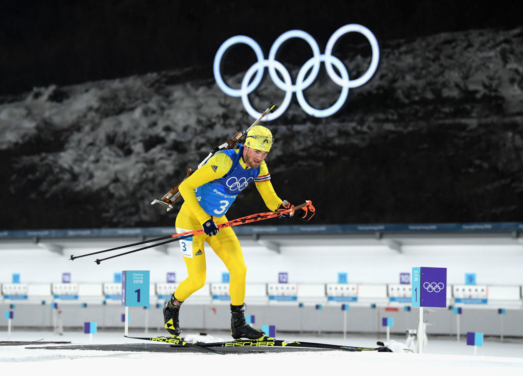 A Swedish athlete prepares to shoot