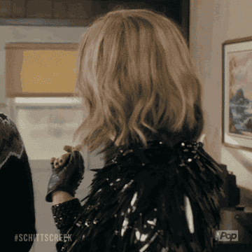 GIF of Moira Rose from &quot;Schitt&#x27;s Creek&quot; saying &quot;hello&quot;