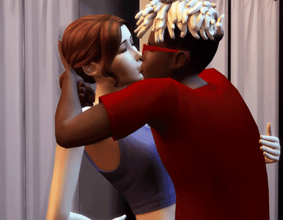 Gameplay of two sims kissing and one walking in the background with a funny fish hat on