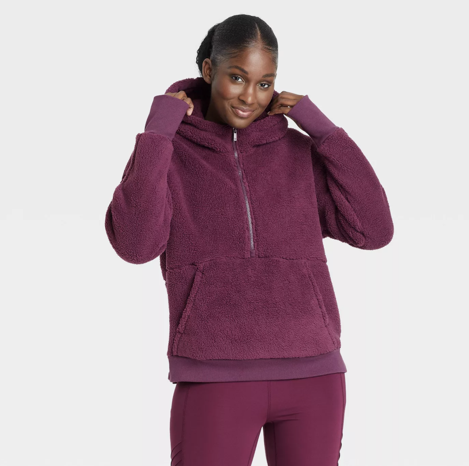 model wearing the pullover in plum