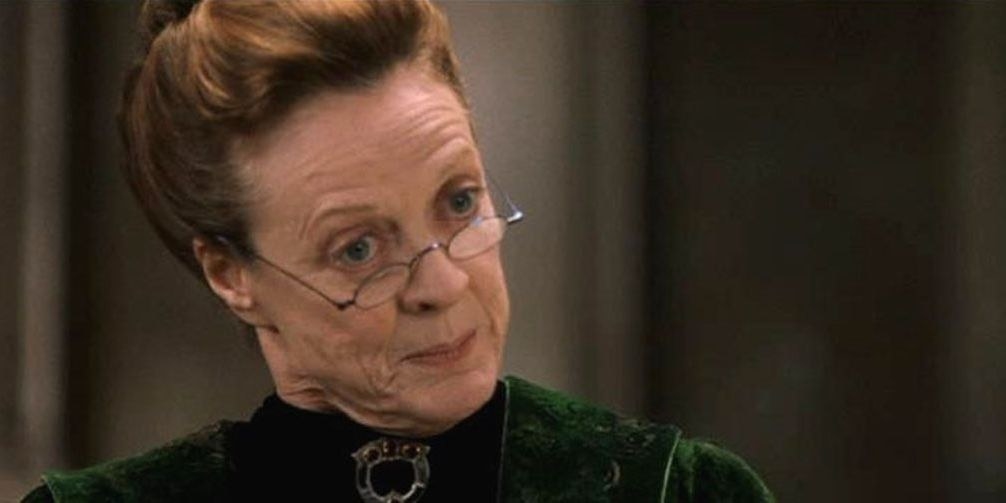 Minerva McGonagall wears a turtleneck and tiny glasses, which she looks over with pursed lips