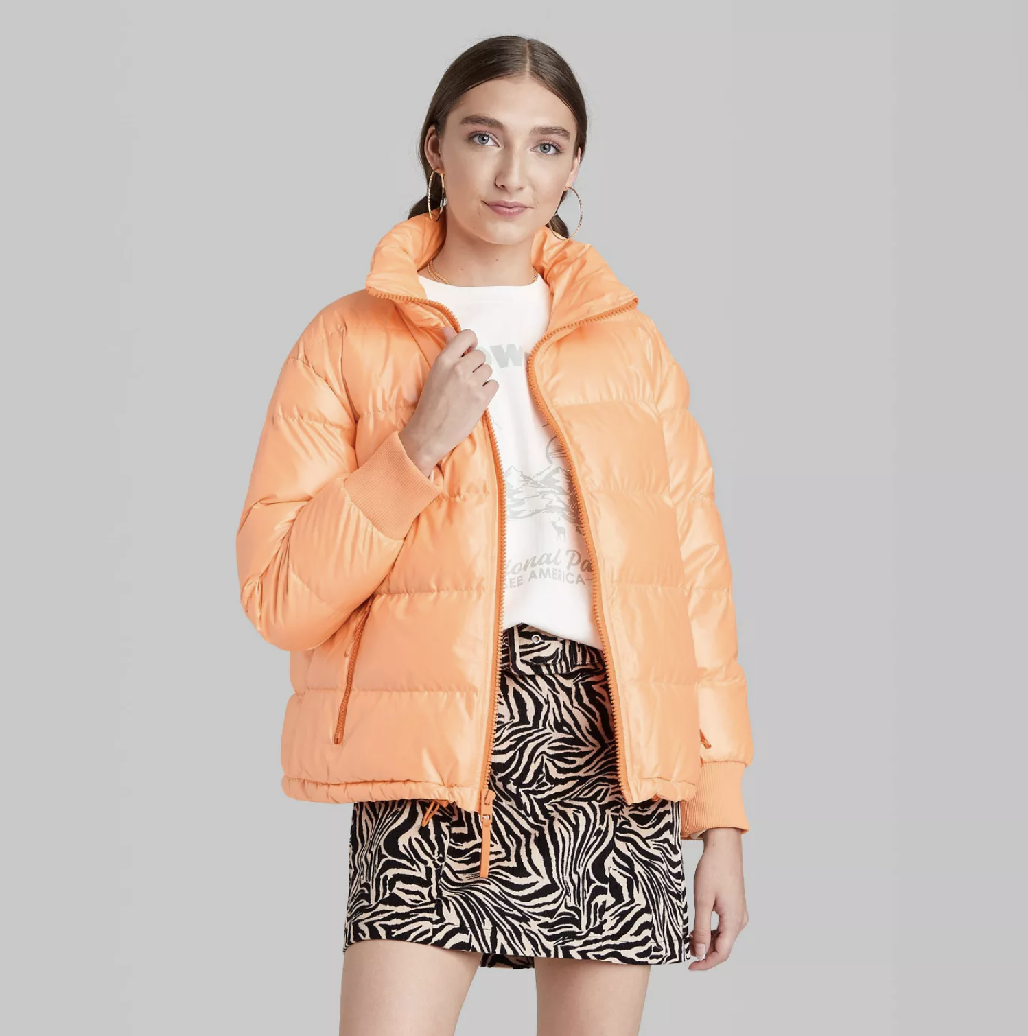 model wearing the puffer jacket in orange