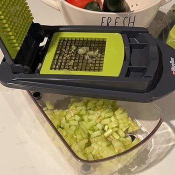 a reviewer photo of diced celery in the chopping unit