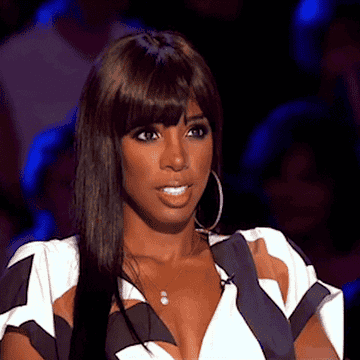 Kelly Rowland looks around awkwardly on X Factorr