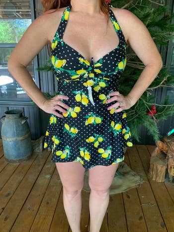 Reviewer photo of them wearing the lemon printed swim dress