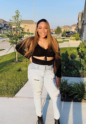 reviewer wearing the black top