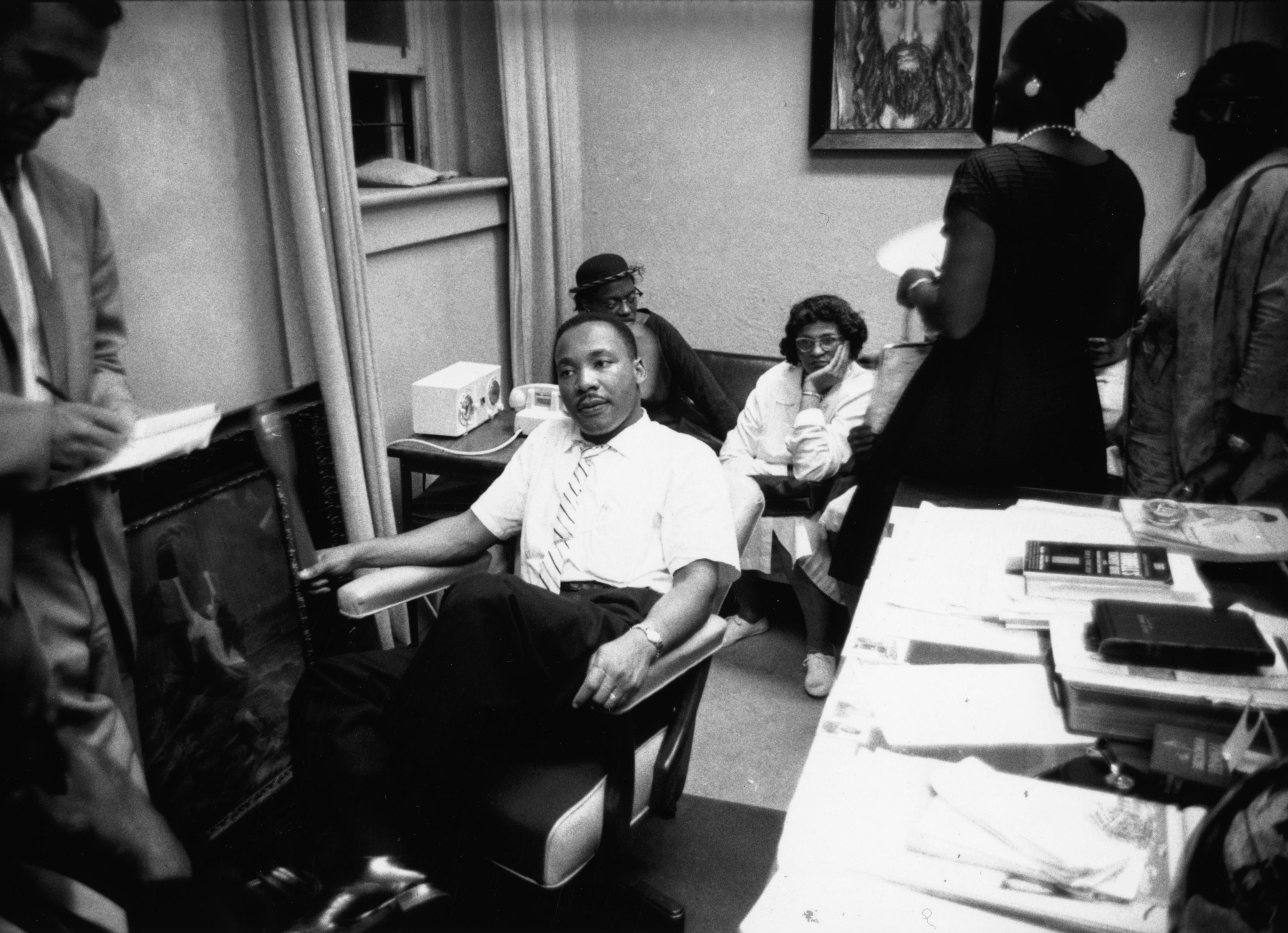 Dr. King sits in a chair