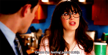 GIF of Zooey Deschanel from New Girl saying, &quot;Cause I&#x27;m feeling pretty twirly.&quot;