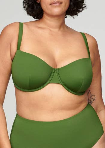Model wearing olive green balconette bikini set