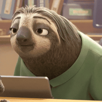 a gif of a sloth from zootopia slowly smiling