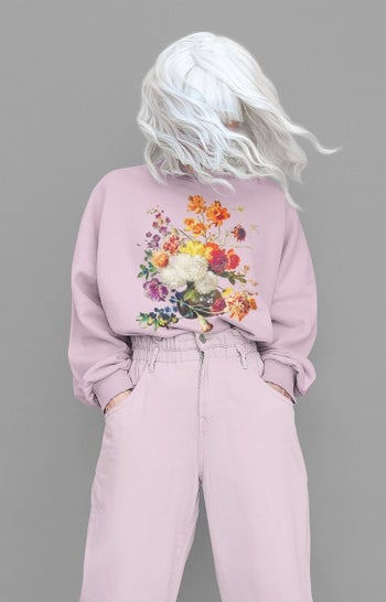 model wearing the purple floral sweatshirt
