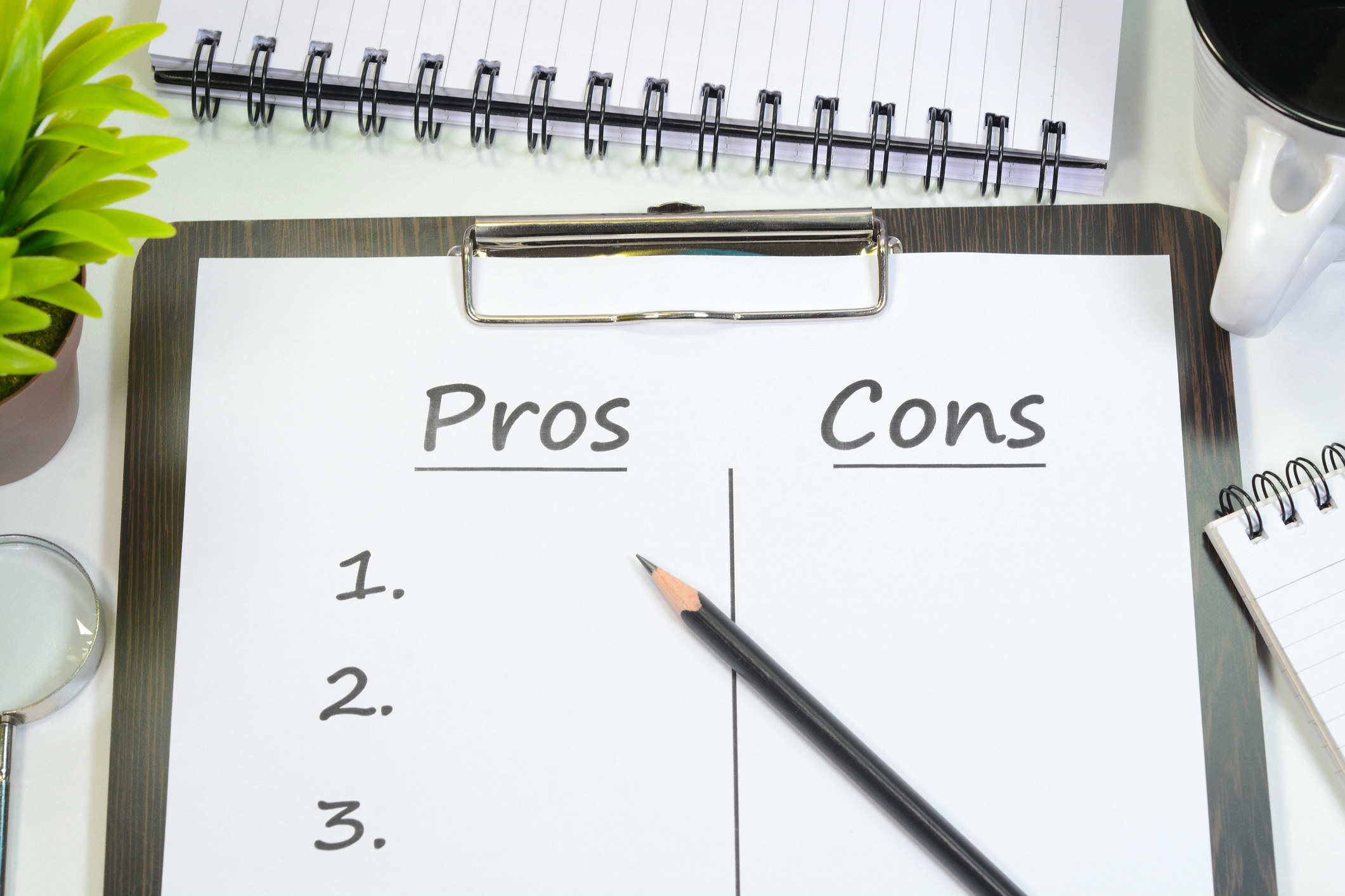 A pros and cons list on a table