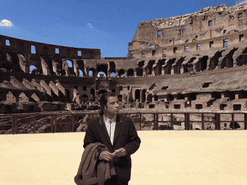 GIF of John Travolta lost meme at the Colosseum