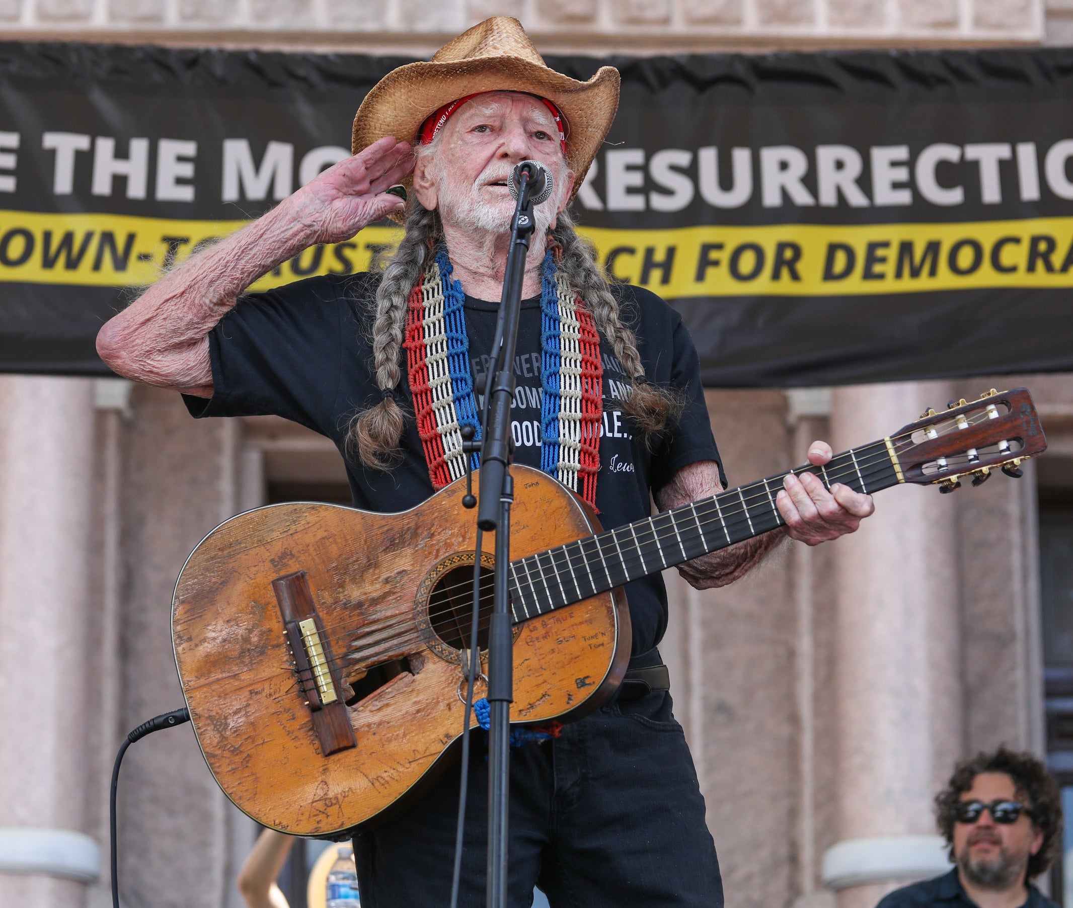 Willie Nelson performing at a rally