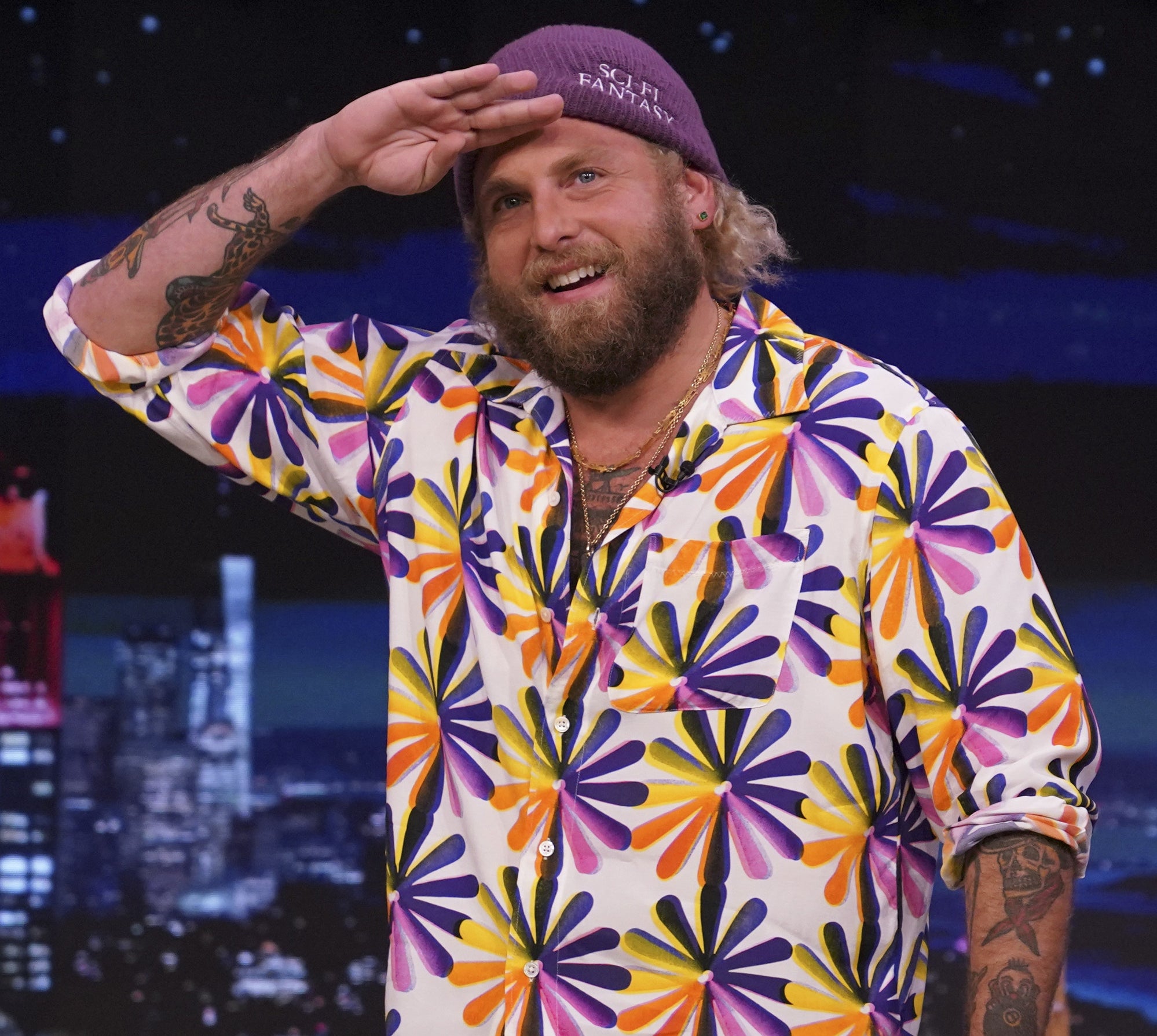 Jonah Hill saluting the audience at "The Tonight Show Starring Jimmy Fallon"